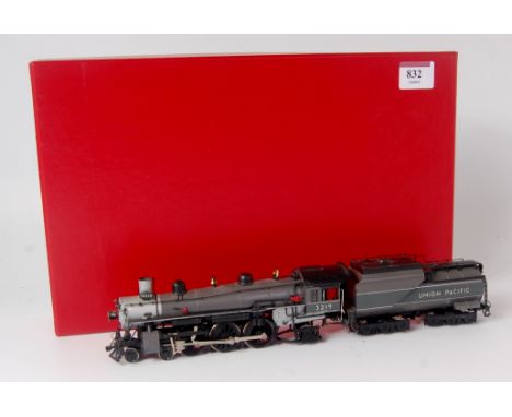 An H0 Korean brass built H0 4-6-2 engine and tender, finished in grey as Union Pacific No. 3219, a few blemishes to paintwork