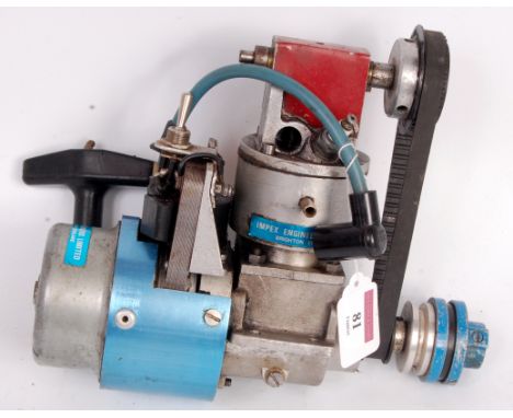 Impex petrol engine with electric ignition, fitted spark plug and belt driven overhead cam shaft, with marine flywheel and ad