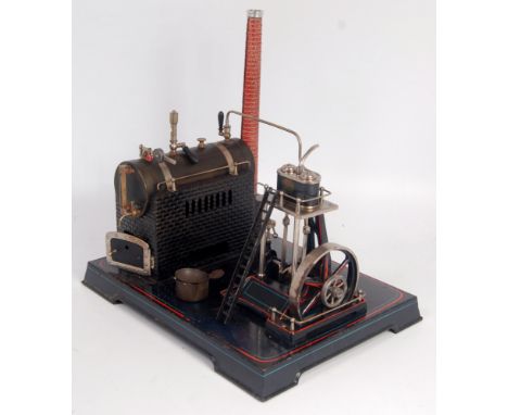 Very unusual Doll et Cie steam plant, comprising of horizontal boiler housed on a brick work effect tin base, with detailed b