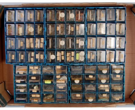 3 trays containing number of plastic storage drawers containing small parts, a rolling road, small tools and two folders of l