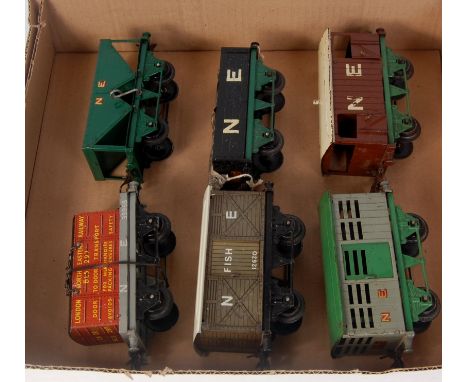 A small tray containing 6 prewar Hornby NE wagons including 1930-2 hopper, 1936-41 flat with container, 1931-3 No. 0 fish van