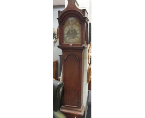 An 18th century 8 day oak longcase clock, the 12inch brass arched dial with silvered chapter ring, second and date dials, uns