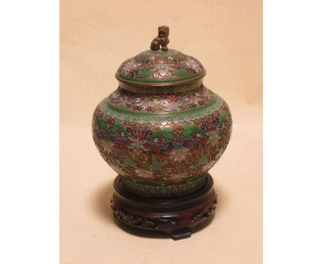 A Chinese open work cloisonne jar, cover and wood stand, 22cm high the jar  