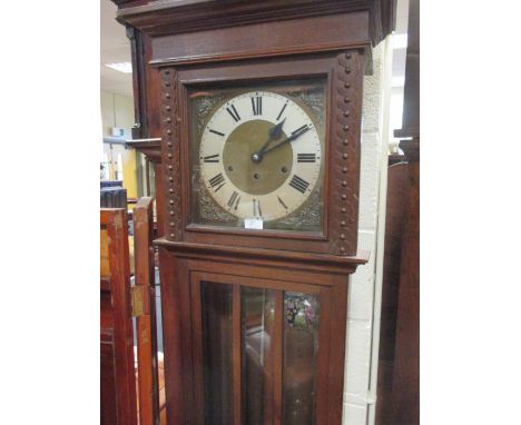 A 20th century oak longcase clock, three train strkers, 180 cm high  