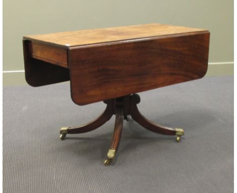 A Regency mahogany sofa table on turned column, downswept legs and cast brass casters, 107 x 52cm  
