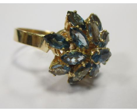 An 18ct blue hardstone, probably topaz, cluster ring, size M-N  