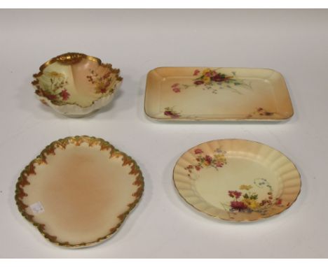 A Royal Worcester shell shaped bowl decorated with flowers, puce mark 12 dots, 19cm long, and three further shaped dishes (4)