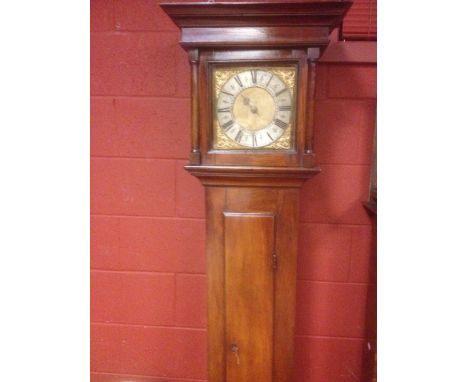 An early 18th century fruitwood longcase clock, the 10inch square brass dial signed 'Thos Steward, Barnett', and engraved 'B,