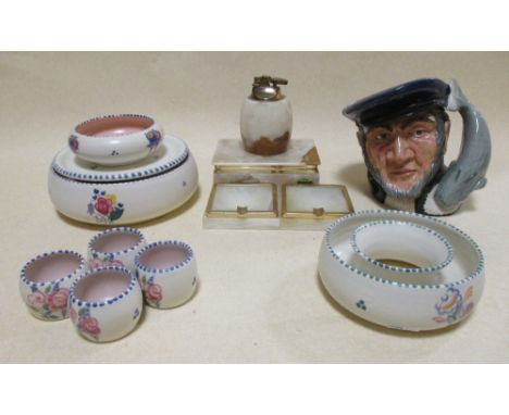 A group of Poole pottery, a Doulton character jug 'Captain Ahab', a Doulton tobacco jar and an onyx smokers set  