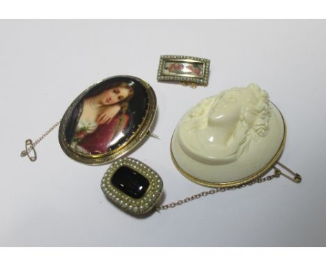 A vegetable ivory cameo brooch in yellow metal mount stamped 14k to hanging bale, an oval portrait miniature brooch and two s
