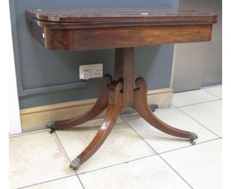 A Regency mahogany and crossbanded foldover card table on turned column and four downsplay legs & castors. 92cm wide  