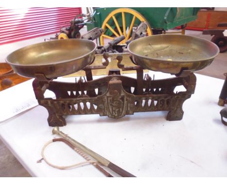 An ornate set of cast iron and brass scales