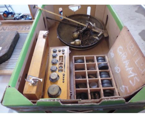 A large set of balance scales and two boxes of weights 