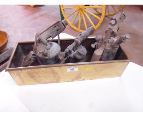 A brass planter; and three blow lamps 
