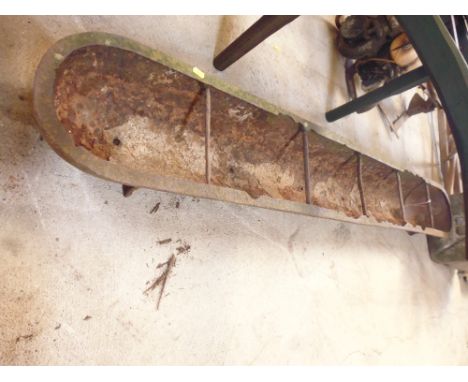 A long cast iron feeing trough, drilled out as a planter 