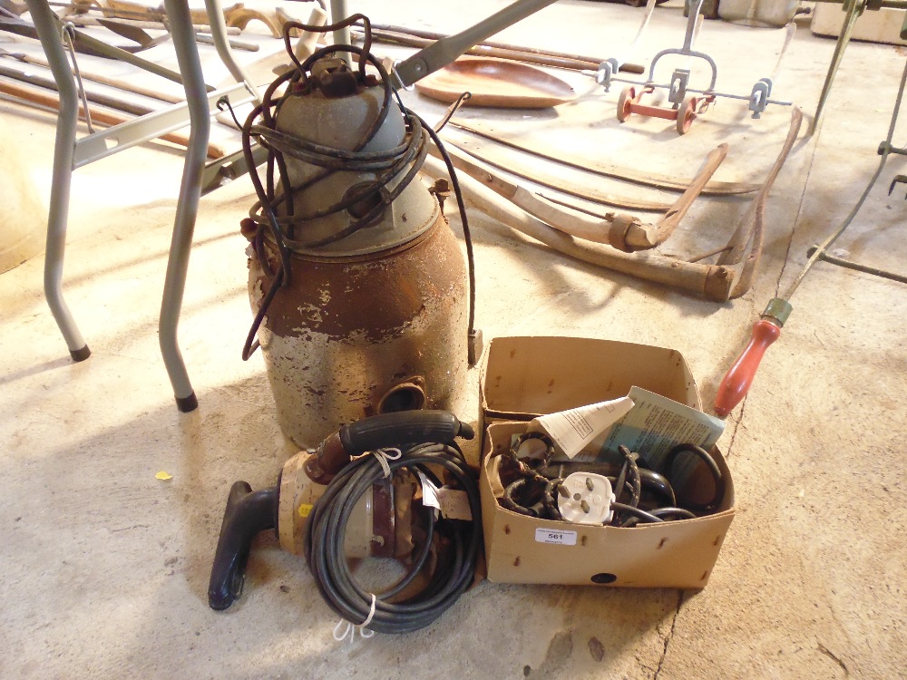 A old Tellus vacuum cleaner; and old hand hoover; and an old electric iron