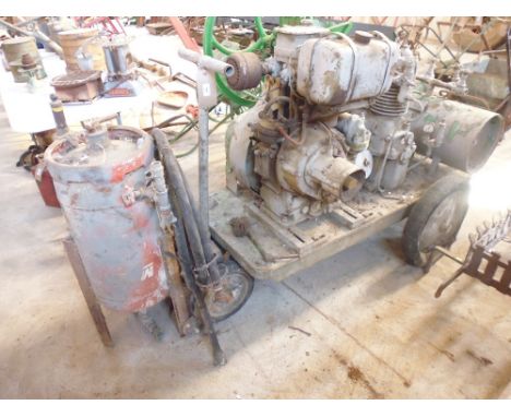 An old Aerocem diesel compressor with Petter engine and starting handle 