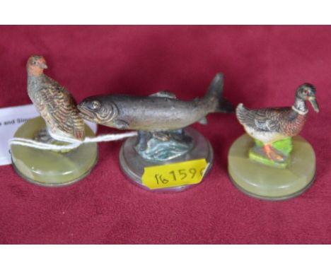 Three bronze table place holders in the form of a salmon, a mallard duck and a partridge