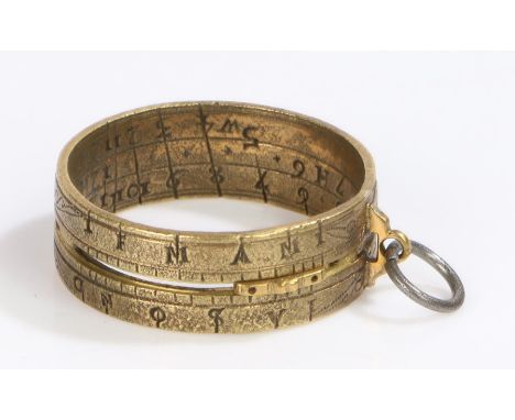 18th Century brass ring sundial, with an adjustable central marker and outer months and inner scale, engraved Absence will pr