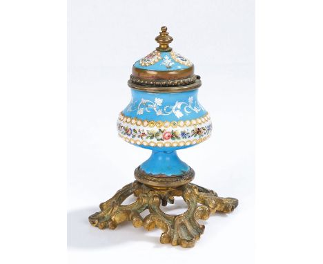 19th Century enamel and gilt metal inkwell, the foliate decoration on blue ground with gilt metal scroll base, 10cm high