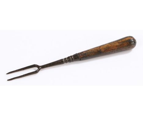 16th Century fork, the smooth tapering handle with an iron twin prong end