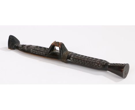 Early 20th Century African knife, with a carved scabbard and handle with hook to the centre and foot to the sheath end, 27.5c