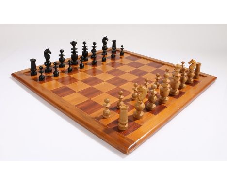 Chess set and board, the chess pieces in ebonised and natural colour, the board in stain wood and mahogany, the king 7cm high