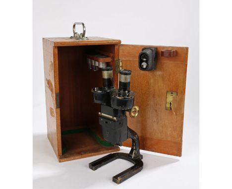 Charles Perry microscope, the black painted body with brass fittings, stamped "D.M.S 1295 M.O.F 29" to left hand eyepiece, ma