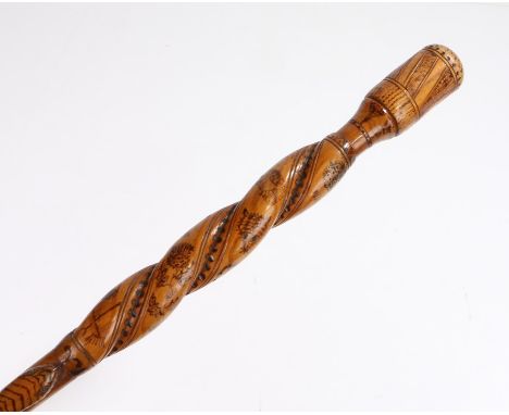 Snake carved walking cane, with snakes trailing up the stick and pokerwork decorated upper section with horse shoes, flowers,