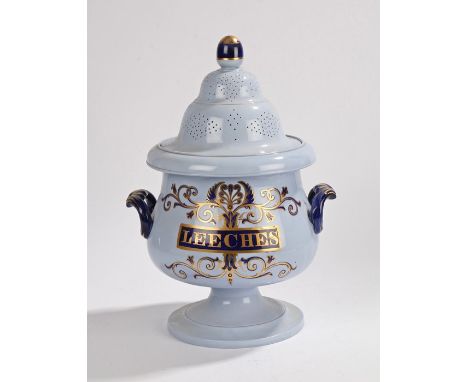 19th Century pottery Leeches jar, the finial top above a pierced lid, the base with a blue and gilt scroll decorated front ti