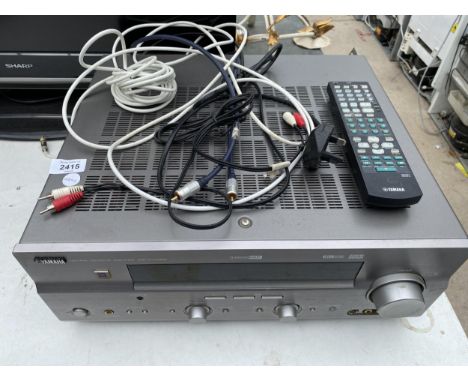 A YAMAHA AV AMPLIFIER VIDEO PLAYER AND REMOTE 