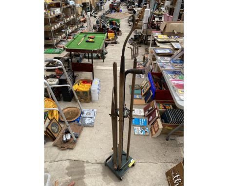 A VINTAGE TOOL STAND AND TOOLS 