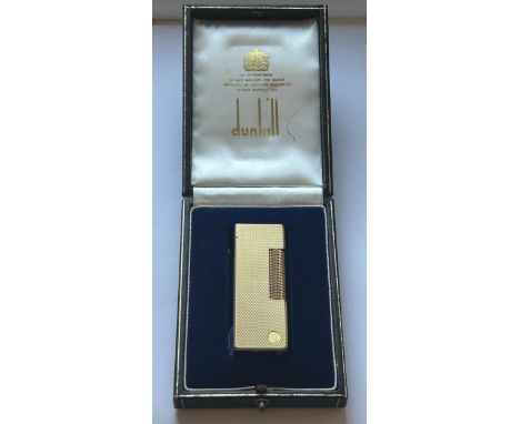 A DUNHILL GOLD PLATED POCKET LIGHTER COMPLETE WITH ORIGINAL FITTED DUNHILL CASE 