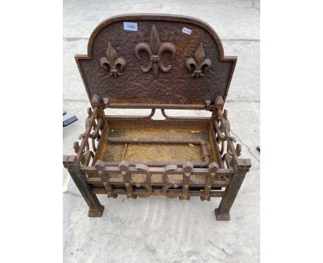 A VINTAGE CAST IRON FIRE GRATE 