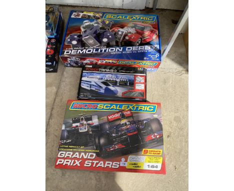 A GROUP OF THREE BOXED TOY ITEMS-  SCALEXTRIC DEMOLITION DERBY &amp; GRAND PRIX STARS 