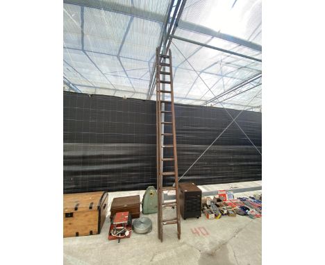 A THIRTY RUNG WOODEN DOUBLE LADDER 