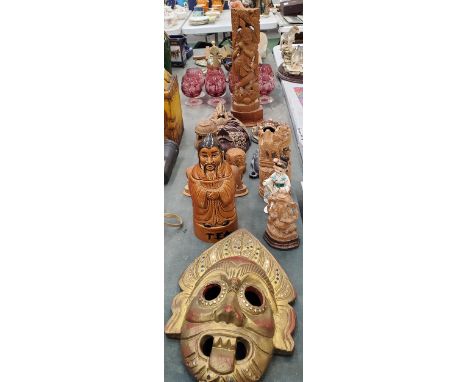 A QUANTITY OF TREEN ITEMS TO INCLUDE MASKS, ELEPHANTS, ASIAN STYLE, A PORCELAIN TEA CADDY, ETC 