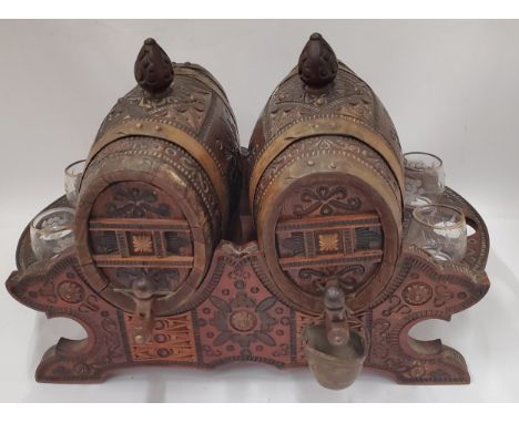 A VINTAGE CARVED WOODEN NORTH AFRICAN DRINKS DISPENSER WITH GLASSES 