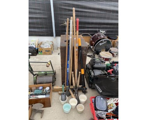 A COLLECTION OF GARDEN TOOLS TO INCLUDE RAKES, POTS, ETC 
