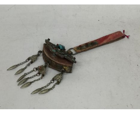 A VINTAGE MIDDLE EASTERN BELT HANGING 