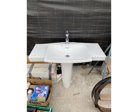 A WHITE CERAMIC SINK UNIT WITH CHROME TAP 