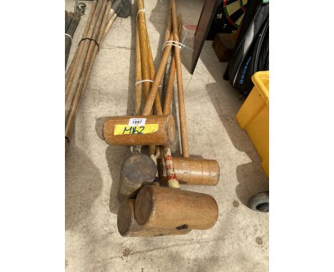 A GROUP OF VINTAGE WOODEN CROQUET MALLETS 