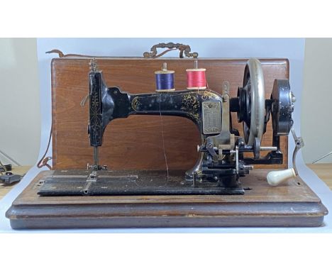 A VINTAGE CASED FRISTER &amp; ROSSMANN SEWING MACHINE 