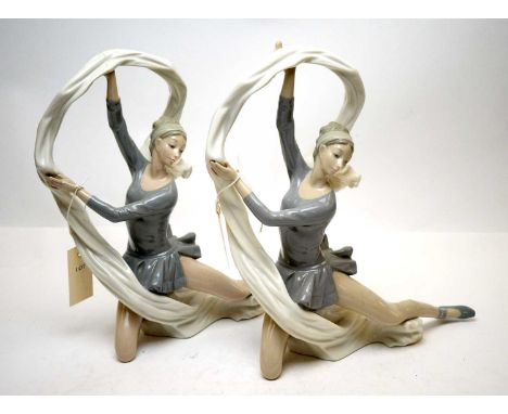 A pair of Nao figures of ballerinas, each modelled dancing with flowing white ribbons, 24.5cms high (damages).