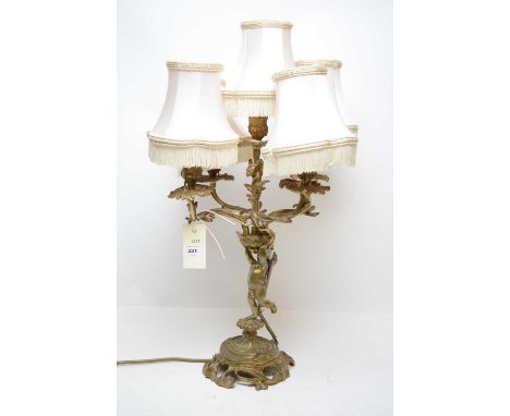 A rococo style gilt metal five-light four-branch table lamp, 57cms high.