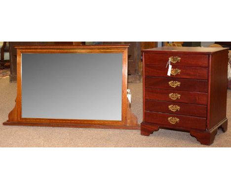 An Edwardian mahogany and satinwood banded overmantel mirror, 115 x 64cms high; and a late 20th Century mahogany six drawer m