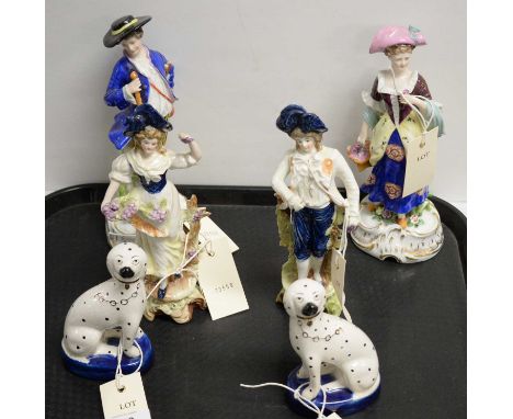 A selection of decorative ceramics, including: a pair of Staffordshire Wally dogs; and four various Continental ceramic figur