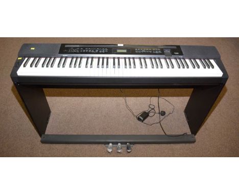 A Casio Privia PX–350M electric piano; and an associated stained beechwood piano stool.