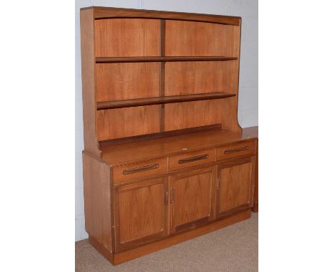 G-Plan: A vintage teak dresser, with shelved superstructure above three short drawers with cupboards below, plinth base, 142 