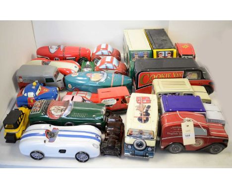 A selection of vintage biscuit tins, many formed as motor cars or buses, by brands including Lamberts, Cadburys, and others; 